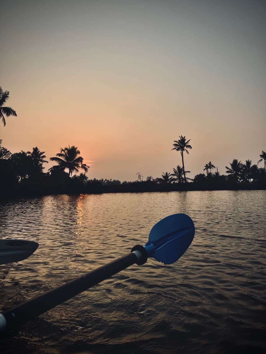 Kayaking on the water at sunset