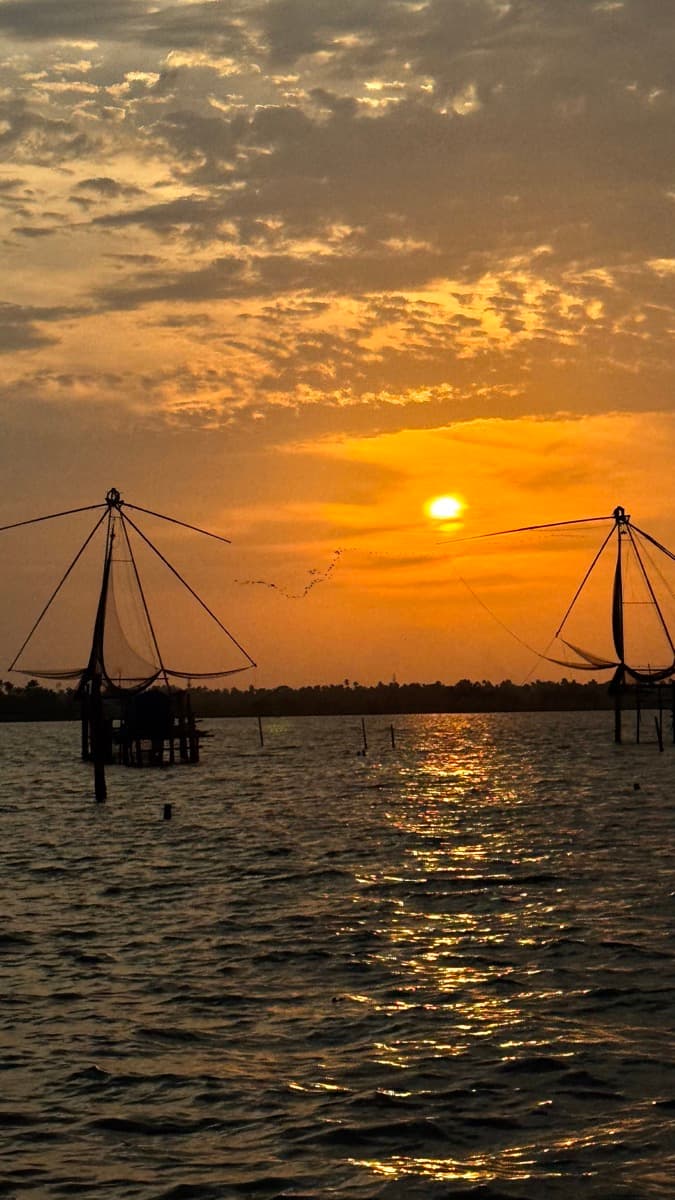 Sunset over fishing nets on the water
